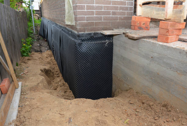 Happy homeowners after waterproofing job in Sharpsburg